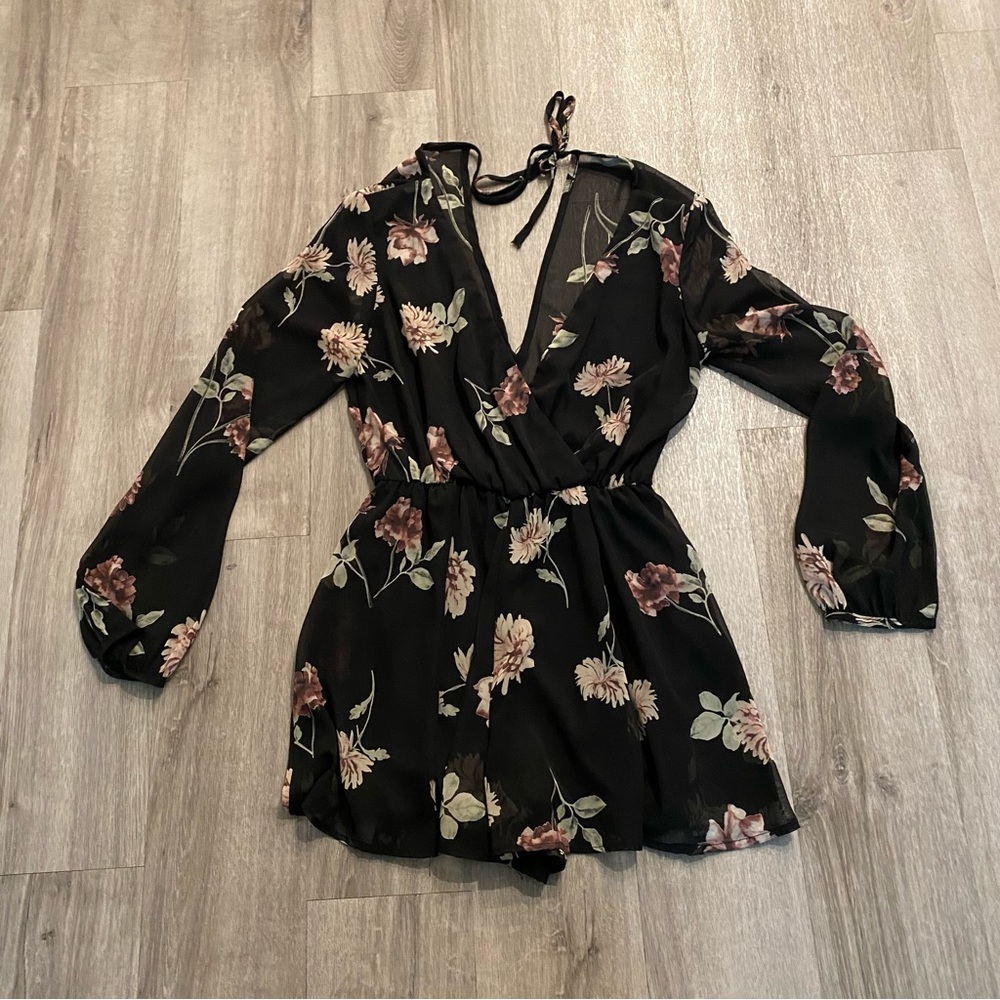 Final Touch black romper with pink & mauve flower detail with long sleeves
